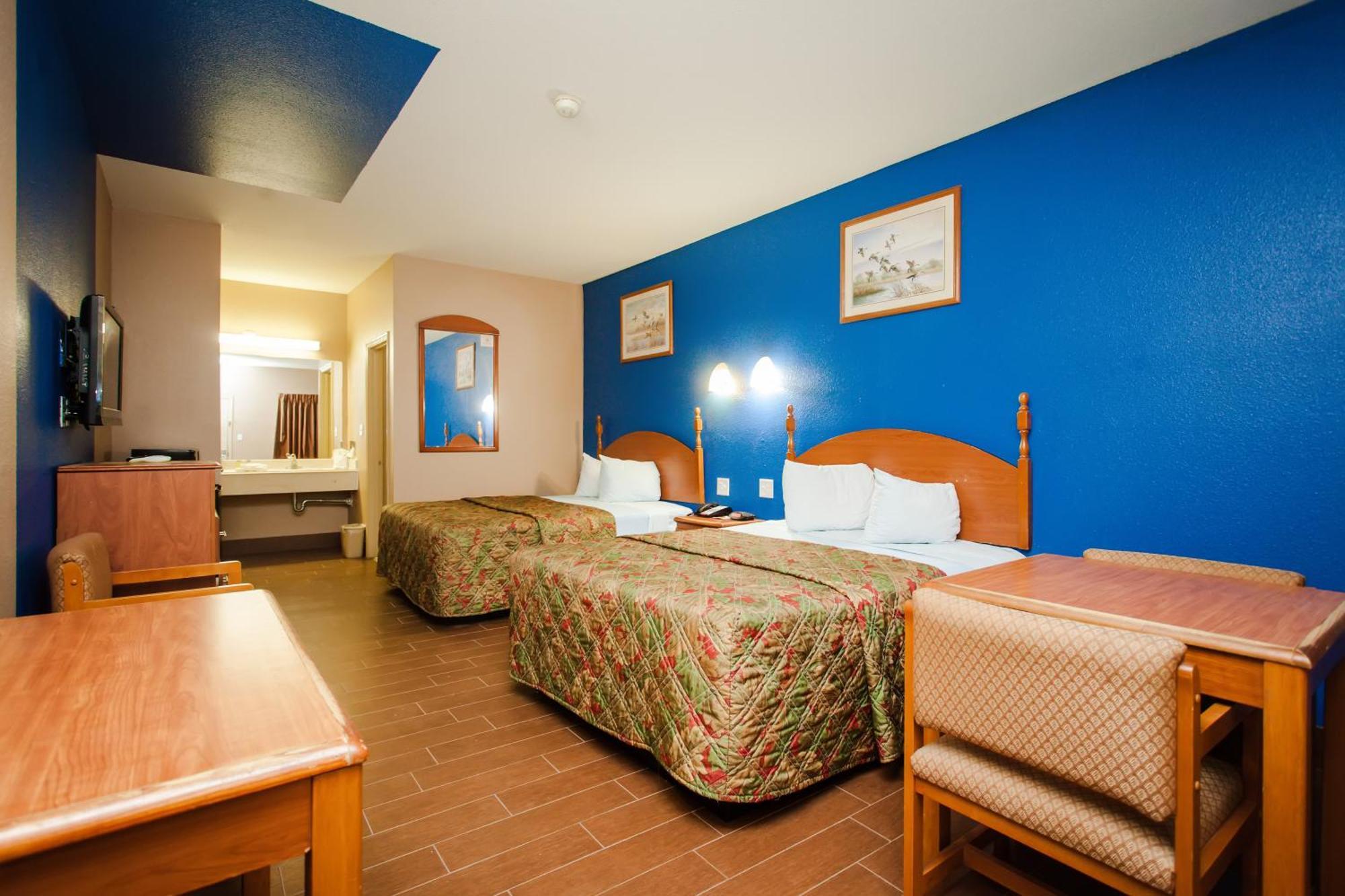 Scottish Inn & Suites Hankamer Oda fotoğraf